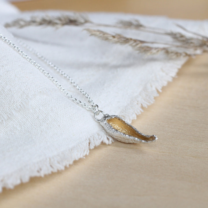 hollow milkweed seed pod necklace