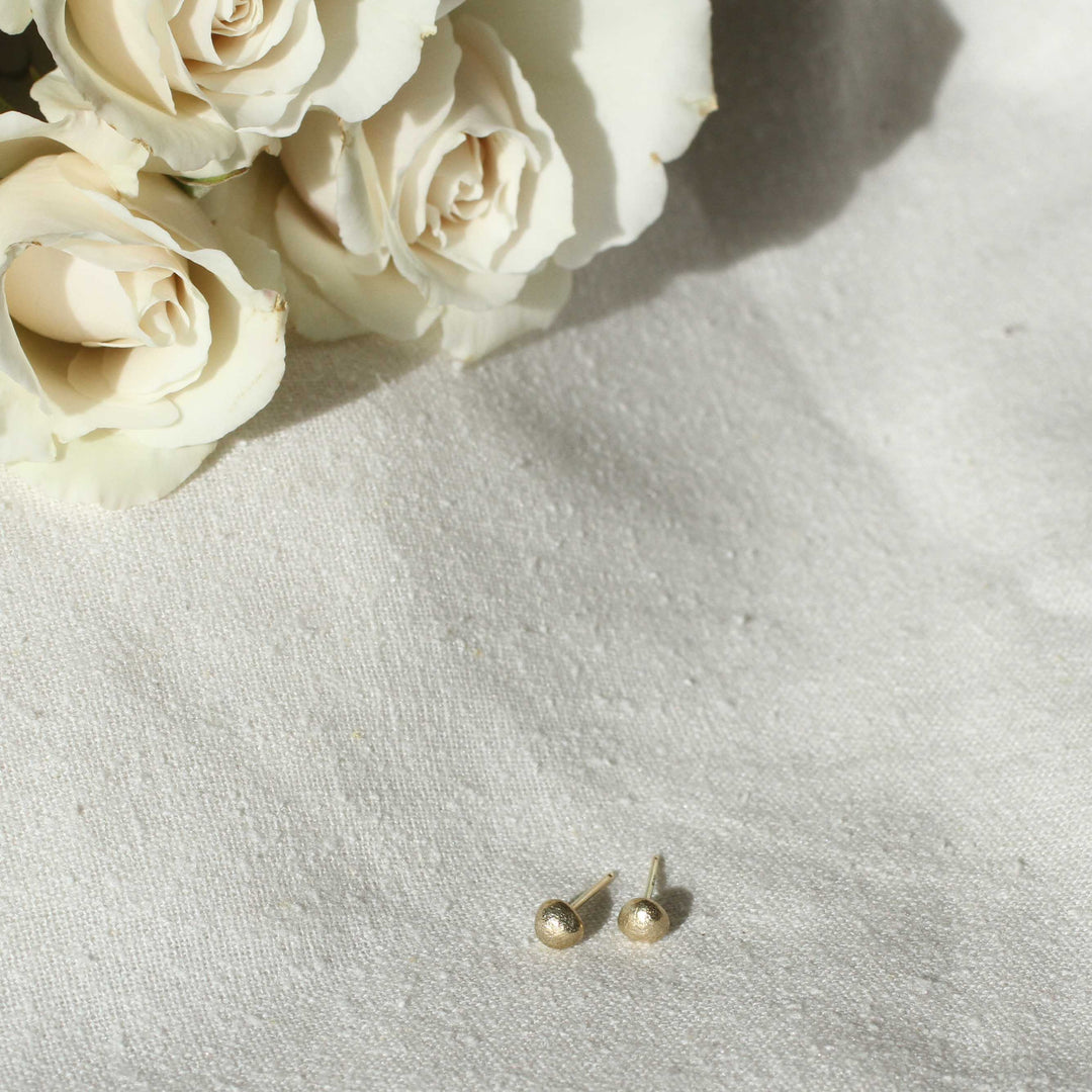 river pebble studs